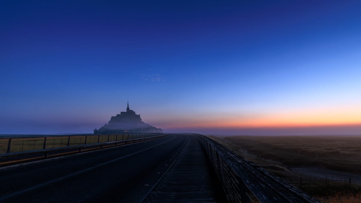 Mont Saint Michel in the mist at sunrise